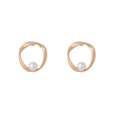 Elegant gold-plated stud earrings with a pearl centerpiece, showcasing an open twist round design.